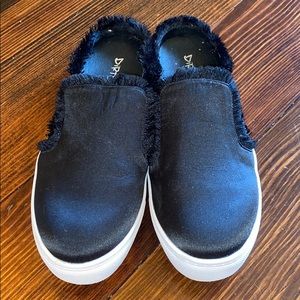 Black slide on shoes with fringe